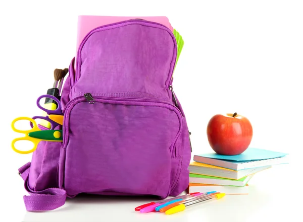 Lila ryggsäck med skolmaterial isolerad på vitt — Stockfoto