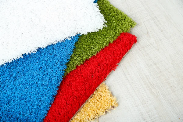 Many carpets of different colors close-up — Stock Photo, Image