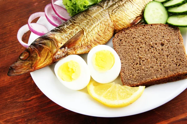 Smoked fish on plate close up — Stock Photo, Image