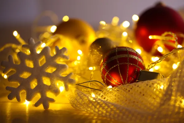 Christmas ornaments and garland on bright background close-up — Stock Photo, Image