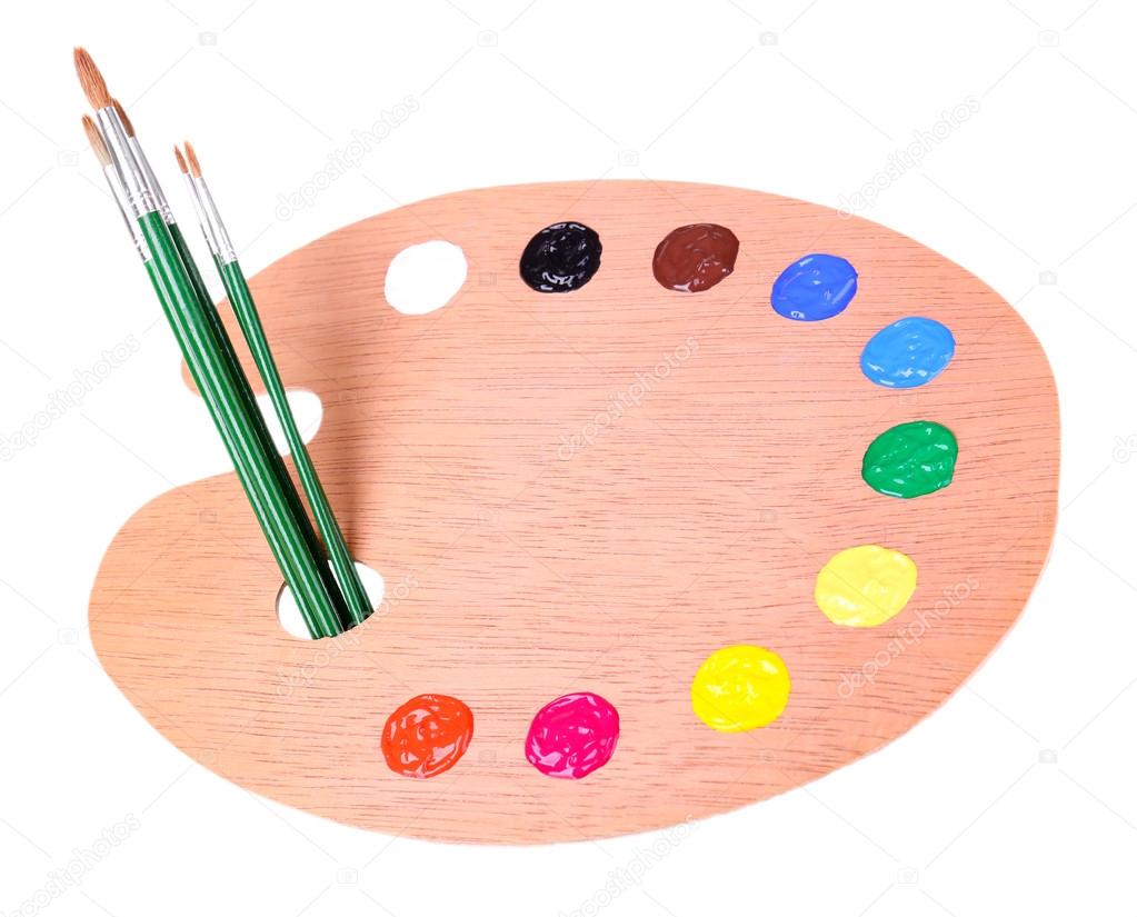 Wooden art palette with paint and brushes isolated on white