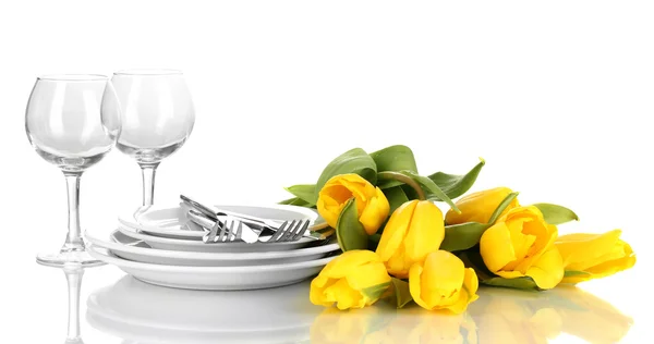 Yellow tulips and utensils for serving isolated on white — Stock Photo, Image