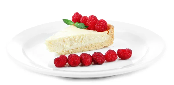 Slice of cheesecake with raspberry on plate, isolated on white — Stock Photo, Image
