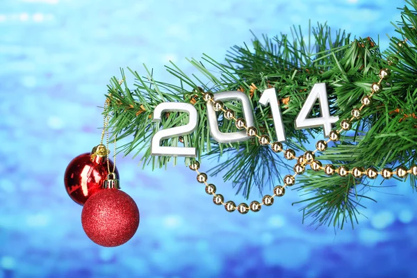 2014 hang on Christmas tree close-up on blue background — Stock Photo, Image