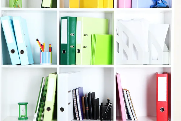 White office shelves with folders and different stationery, close up — Stock Photo, Image