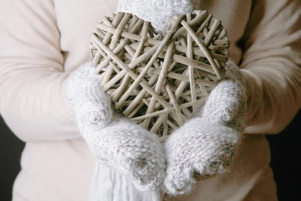 Female hands in mittens with heart, close-up — Stock Photo, Image