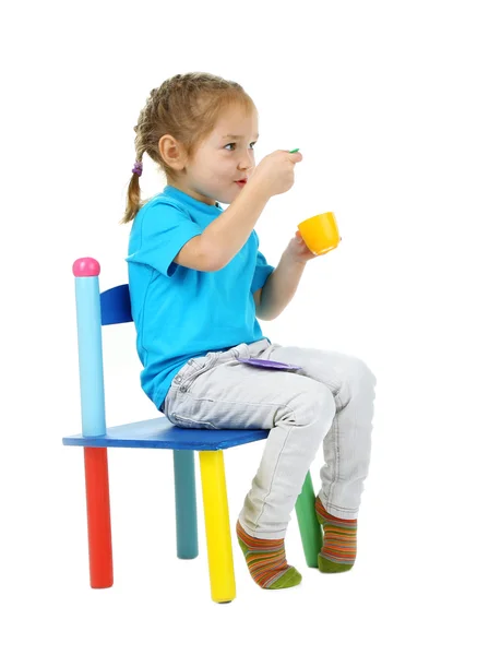 Little children playing with colorful tableware — Stock Photo, Image