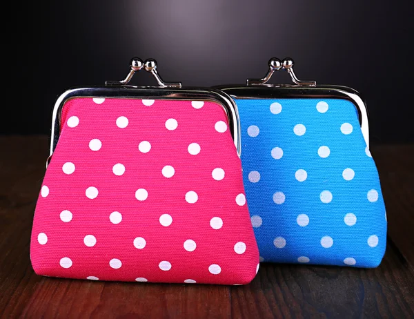 Blue and pink purses on table on black background — Stock Photo, Image