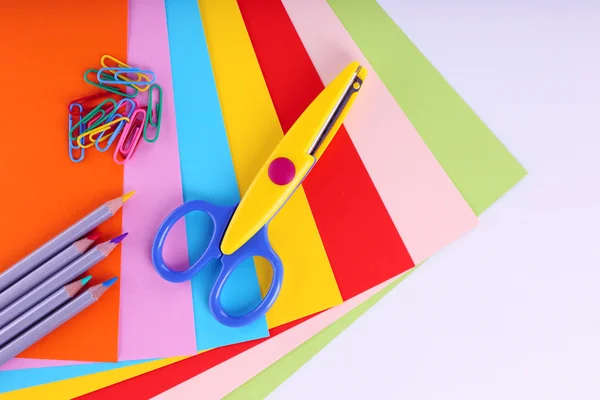 Colorful cardboard and scissors on white background — Stock Photo, Image