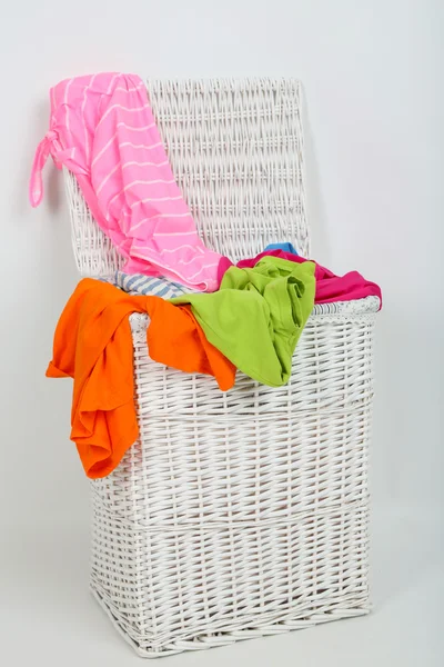 Full laundry basket isolated on white — Stock Photo, Image