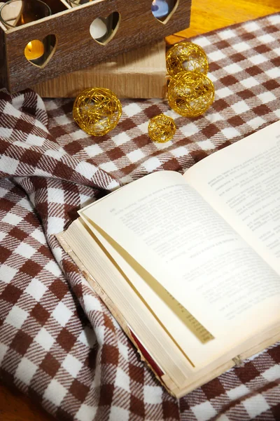 Composition with old book, eye glasses and plaid on wooden background — Stock Photo, Image