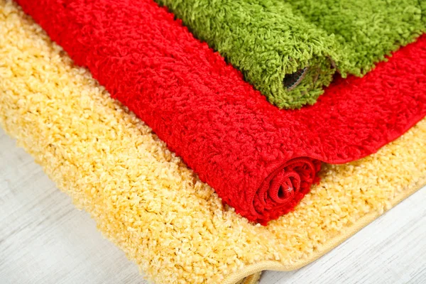 Many carpets of different colors close-up — Stock Photo, Image