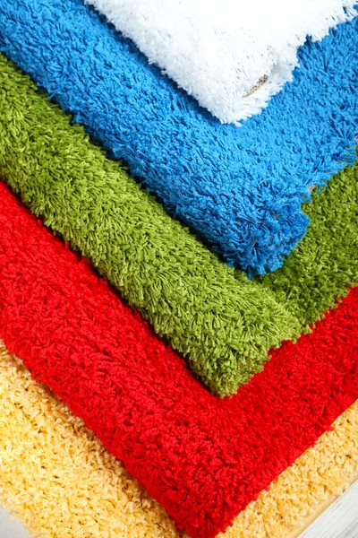 Many carpets of different colors close-up — Stock Photo, Image