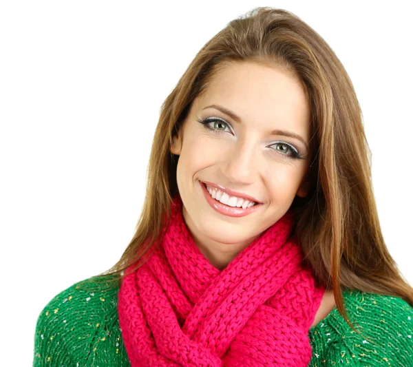 Vacker leende flicka i varm stickad halsduk isolerad på vit — Stockfoto