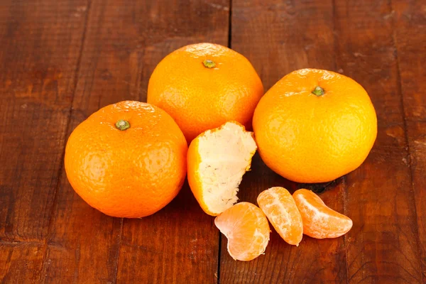 Tasty mandarines on wooden background — Stock Photo, Image