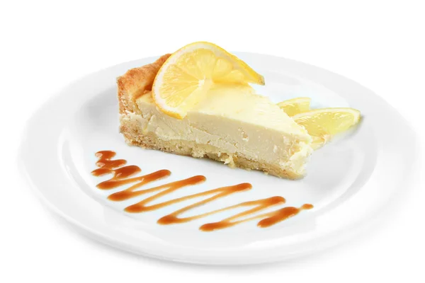 Slice of lemon cheesecake and sauce on plate, isolated on white — Stock Photo, Image