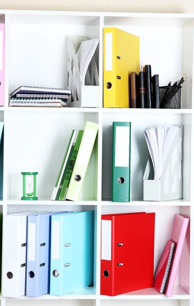 White office shelves with folders and different stationery, close up — Stock Photo, Image