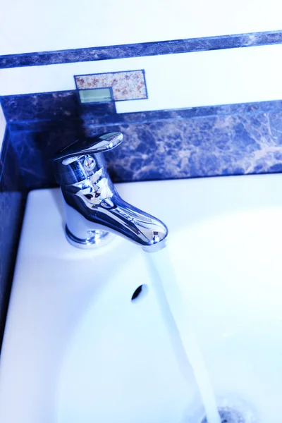 Ceramic sink with chrome fixture, close up — Stock Photo, Image