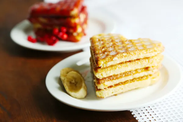 Sweet waffles on plates. on wooden background — Stock Photo, Image