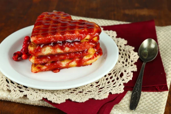 Sweet Belgium waffles with jam, on wooden table background — Stock Photo, Image