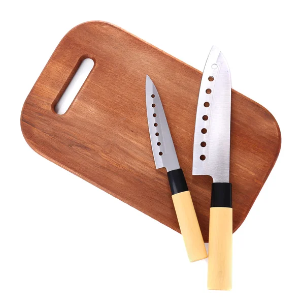 Kuchyňské nože a krájecí prkénko, izolované na bílém — Stock fotografie