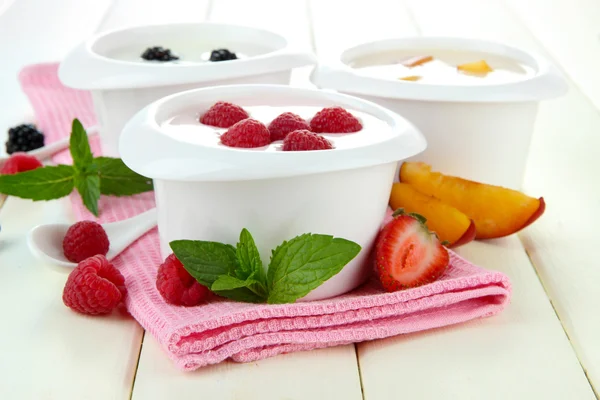 Delicious yogurt with fruit and berries on table close-up Stock Photo