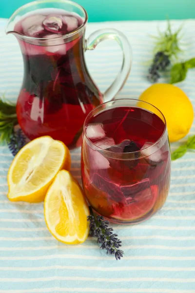 Red basil lemonade in jug and glass, on wooden background — Stock Photo, Image