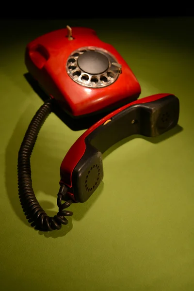 Red retro telephone on dark color background — Stock Photo, Image