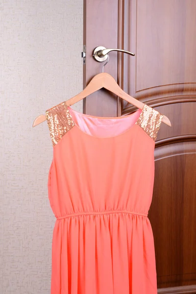 Dress hanging on door — Stock Photo, Image