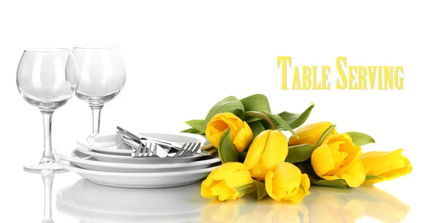 Yellow tulips and utensils for serving isolated on white — Stock Photo, Image