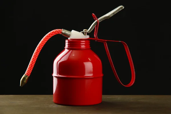 Oil can on black background — Stock Photo, Image