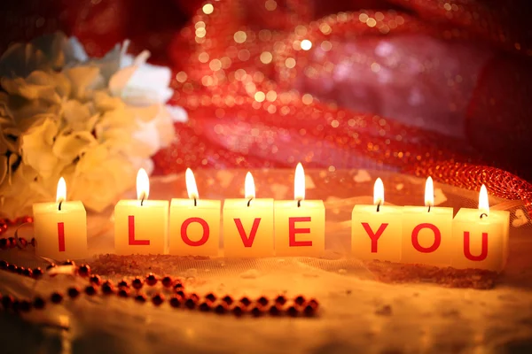 Candele con cartello stampato I LOVE YOU, su sfondo luminoso — Foto Stock