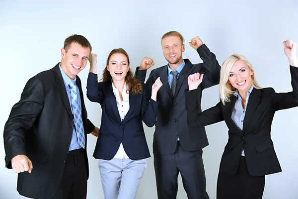 Group of business people on gray background — Stock Photo, Image