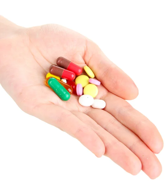 Pilules à la main isolées sur blanc — Photo