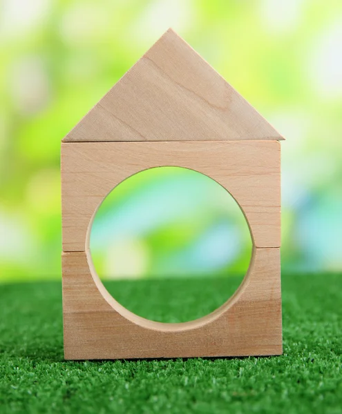 Wood house on grass on natural background — Stock Photo, Image