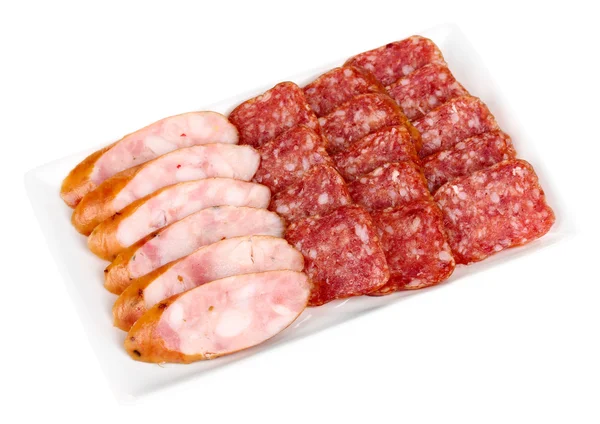 Tasty sliced sausage on plate isolated on white — Stock Photo, Image