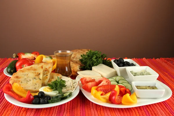 Traditional Turkish breakfast on table on brown background — Stock Photo, Image