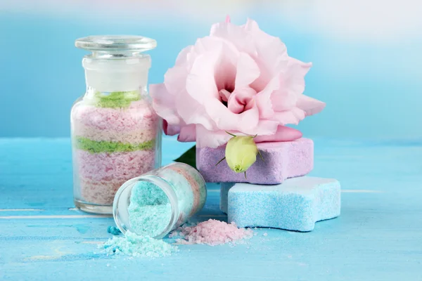 Aromatic salts in glass bottles, on blue background — Stock Photo, Image