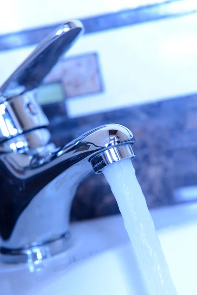 Ceramic sink with chrome fixture, close up — Stock Photo, Image