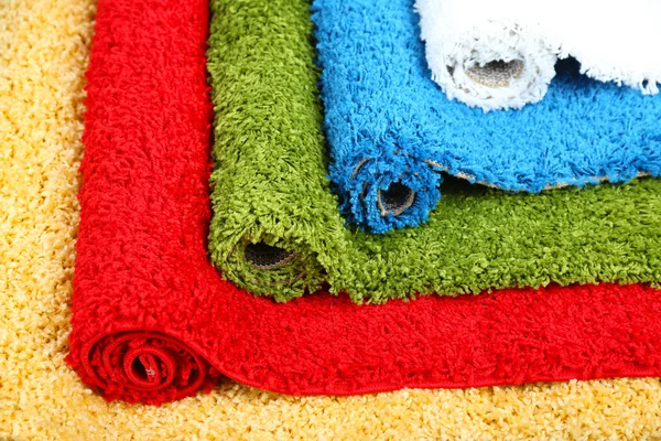 Many carpets of different colors close-up — Stock Photo, Image