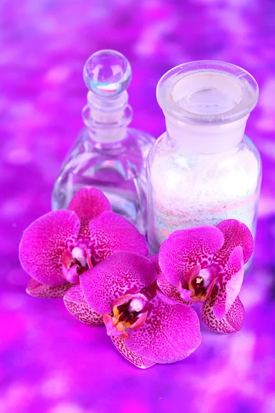 Beautiful spa setting with orchid on purple background — Stock Photo, Image