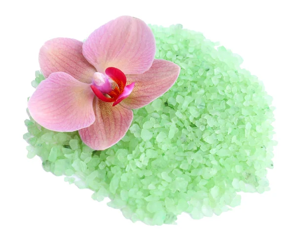 Beautiful blooming orchid flower and heap of sea salt — Stock Photo, Image