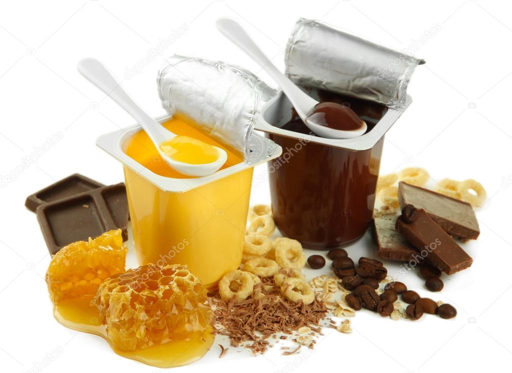 Tasty desserts in open plastic cups and honey combs, isolated on white