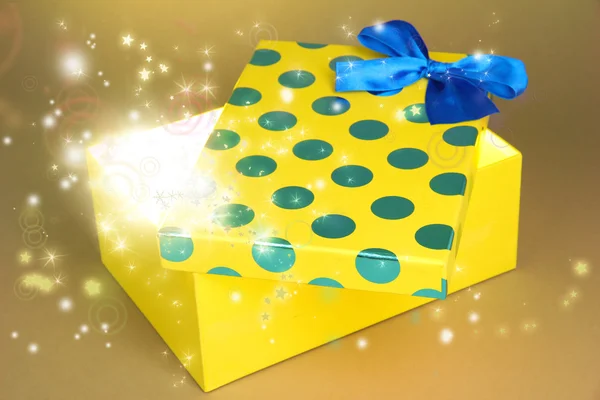 Gift box with bright light on it — Stock Photo, Image