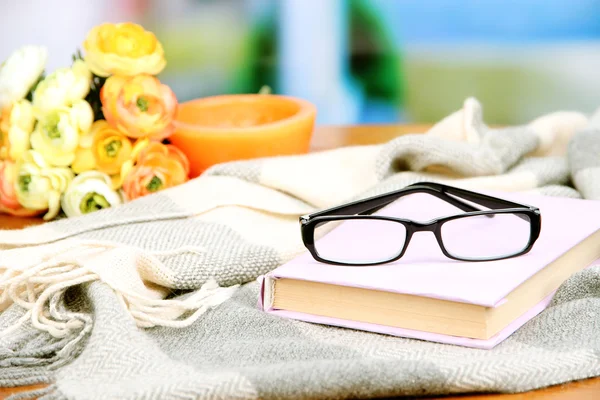 Old book, eye glasses, candles, flowers and plaid — Stock Photo, Image