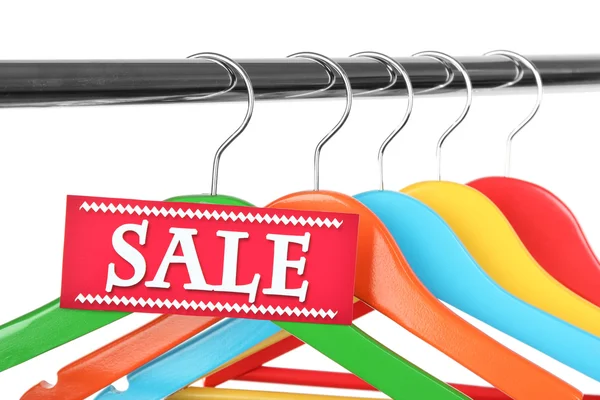 Clothes hangers as sale symbol — Stock Photo, Image