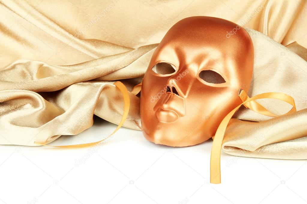 Mask on gold fabric