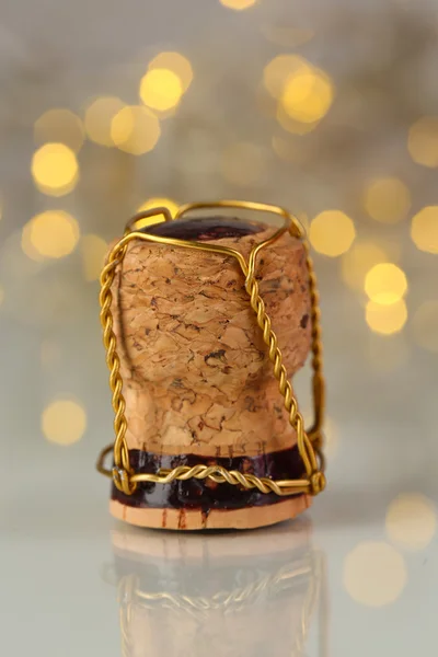 Champagne cork on Christmas lights background — Stock Photo, Image