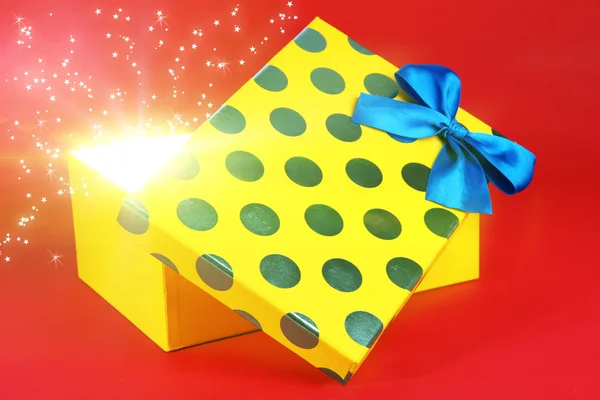 Gift box with bright light on it — Stock Photo, Image