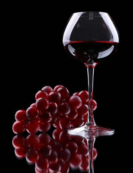 Wineglass with red wine, isolated on black — Stock Photo, Image